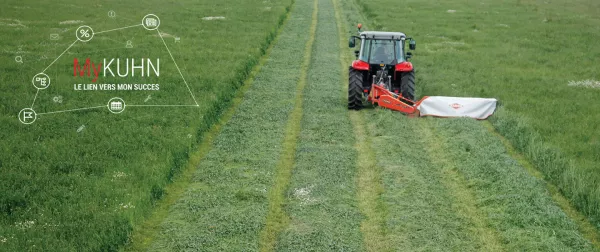 KUHN GMD disc mower mowing hay with the MyKUHN logo placed on the left side of image. 